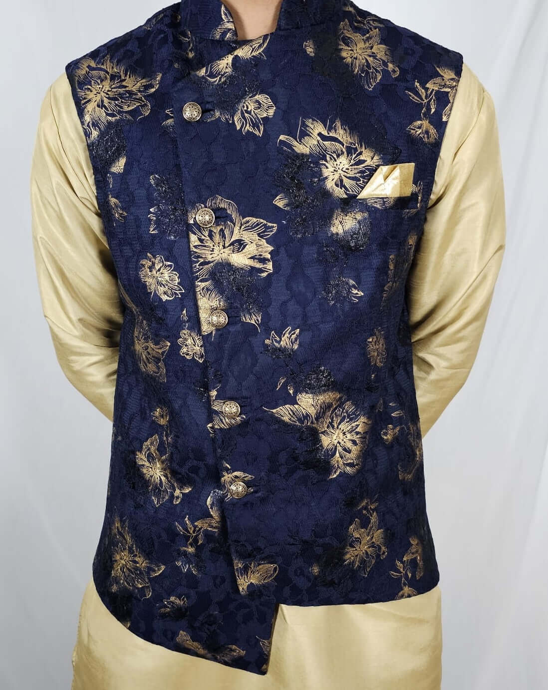 Front view of Men's Indian Nehru Jacket in navy blue with printed fabric, thread embroidery, gold buttons with stone work, and matching hankie.