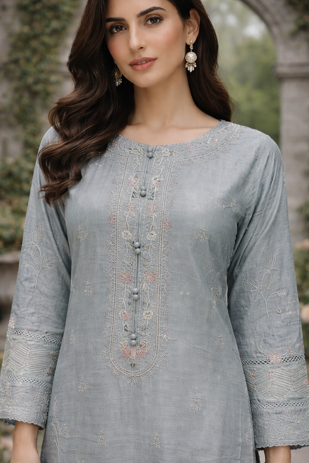 ladies grey trouser suit. close view without scarf