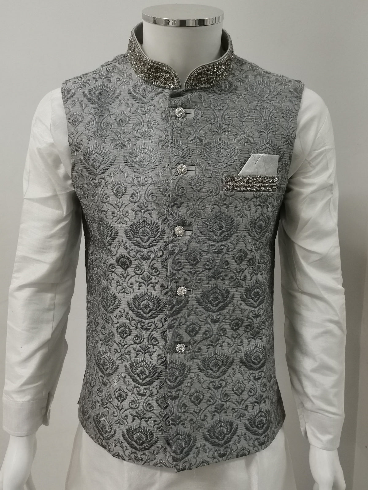 Grey embroidered Men's Indian Nehru Jacket for weddings with stone work on the pocket, silver buttons with stone work, matching hankie, and stone work on the collar.